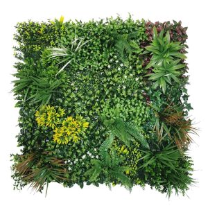 Panel vegetal con flor amarilla Line Bilbao, con racimos de flor amarilla y hojas granates entre el follaje verde